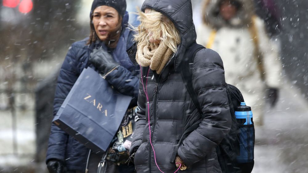 Shoppers on Chicago's Magnificent Mile endure blowing snow and high winds off Lake Michigan as a winter storm begins in the greater Chicago and northwest Indiana area, in Chicago. The storm is moving through parts of the Midwest stretching from Missouri northeast through Illinois, Indiana and Michigan, with blizzard warnings for counties in eastern Illinois and northwestern IndianaWinter Weather, Chicago, USA