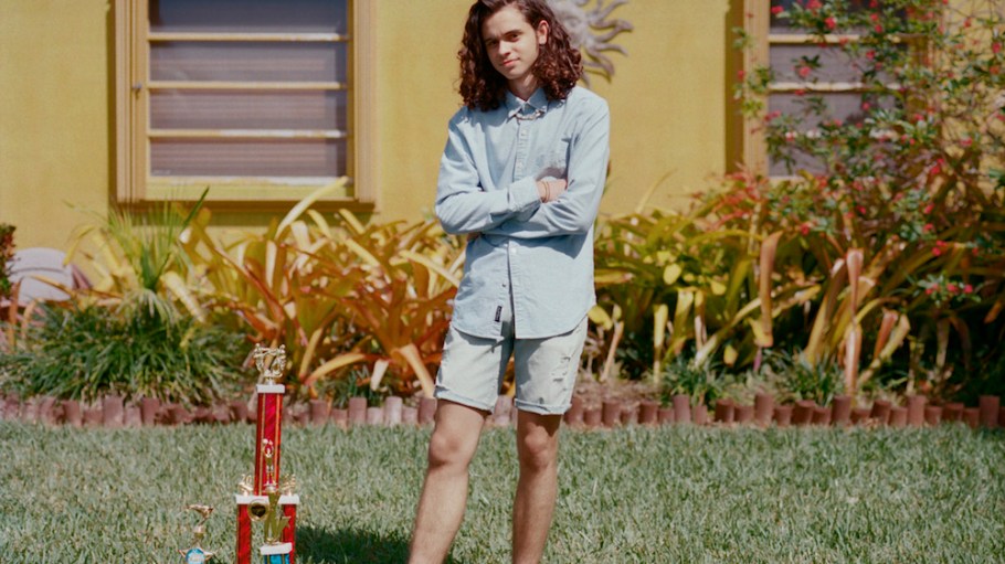 guy in denim in front yard
