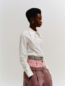 Pihakapi’s cotton shirt and Natasha Zinko’s wool blend pants. Jennifer Fisher earring and Versace necklace.