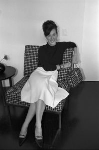 Handbag designer Kate Spade sitting on a chair with a matching pattern handbag in her showroom in New York.Kate Spade, New York