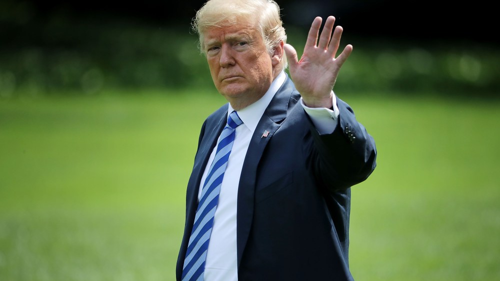 U.S. President Donald Trump waves to journalists as he walks across the South Lawn before boarding Marine One and departing the White House in Washington, DC. Trump is traveling to Camp David.Members of the Trump Family depart White House, Washington DC, USA - 01 Jun 2018
