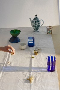 From top, clockwise: Gucci's coffee pot; Lobmeyr's floral motif tumbler at Moda Operandi; Laguna B's glass, available exclusively at Moda Operandi; Carl AbockÕs brass paperweight available at Matches.com; Jennifer FisherÕs 10-karat gold-plated ring; Dinosaur Designs' resin bowl, available at Moda Operandi; Jonathan Adler's votive candleholder, and Poltrona Frau Style and Design CentreÕs plexi case.