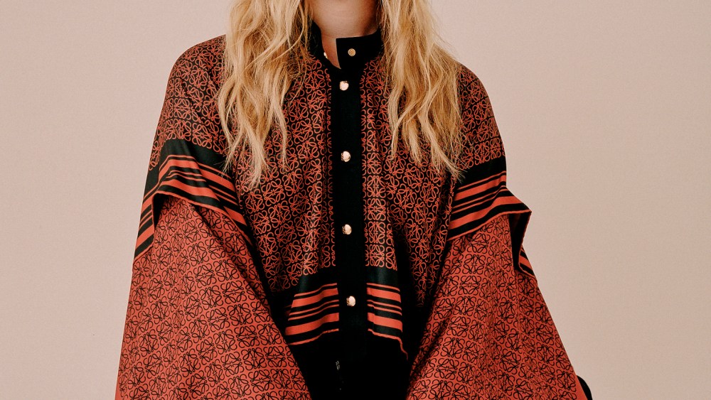 LoeweÕs silk shirt and Proenza SchoulerÕs cotton trousers, both available at Saks Fifth Avenue; Mounser earring; Spinelli Kilcollin earring and rings; Calvin Klein 205W39NYC boots.