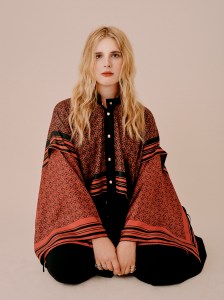 LoeweÕs silk shirt and Proenza SchoulerÕs cotton trousers, both available at Saks Fifth Avenue; Mounser earring; Spinelli Kilcollin earring and rings; Calvin Klein 205W39NYC boots.