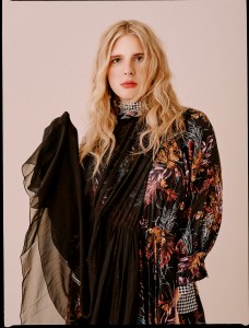 BalenciagaÕs silk dress; Mounser earring; Spinelli Kilcollin earring and rings; Calvin Klein 205W39NYC boots.