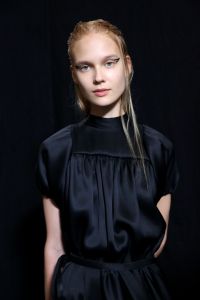 Rochas artistic director Alessandro DellÕAcqua had a film-noir-esque scenario in mind for the beauty look of the show. So hairstylist Anthony Turner putÊthe LÕOral Professionnel Wet Domination styling sprayÊon modelsÕ tresses. ÒWe just want to create the illusion of wet hair without actually using water, because obviously that dries quickly,Ó he said. Describing the woman in mind, he explained:ÊÊÒSheÕs kind of like in the rain from wherever to wherever. ThereÕs a bit of mystery surrounding her. WeÕre really playing with narrative, and just having fun with that.Ó Turner added: ÒThereÕs a little darkness, a little sexiness.Ó Ñ Jennifer WeilÊ