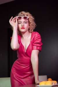 Julia Garner in Area’s lambskin leather dress. Adam Selman x Le Specs sunglasses.
