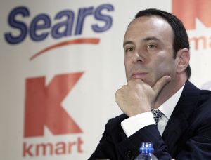 Kmart chairman Edward Lampert listens during a news conference to announce the merger of Kmart and Sears in New York , 2004.