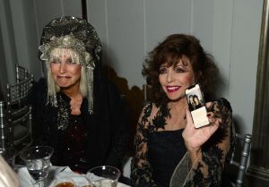 Virginia Bates and Joan Collins attended the 'Zodiac Party' celebrating the launch of Claridge's 'The Tree of Love' Christmas Tree