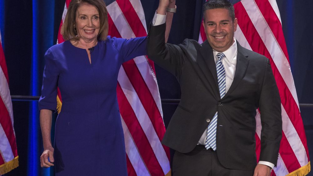 Democratic House Minority leader from California Nancy Pelosi (L) and Democratic Congressional Campaign Committee chair Ben Ray Lujan (R) from New Mexico react to early returns from the 2018 midterm general election during a House Democratic Election Night event at the Hyatt Regency in Washington, DC, USA, 06 November 2018.House Democratic leaders watch 2018 midterm election returns in Washington, DC, USA - 06 Nov 2018
