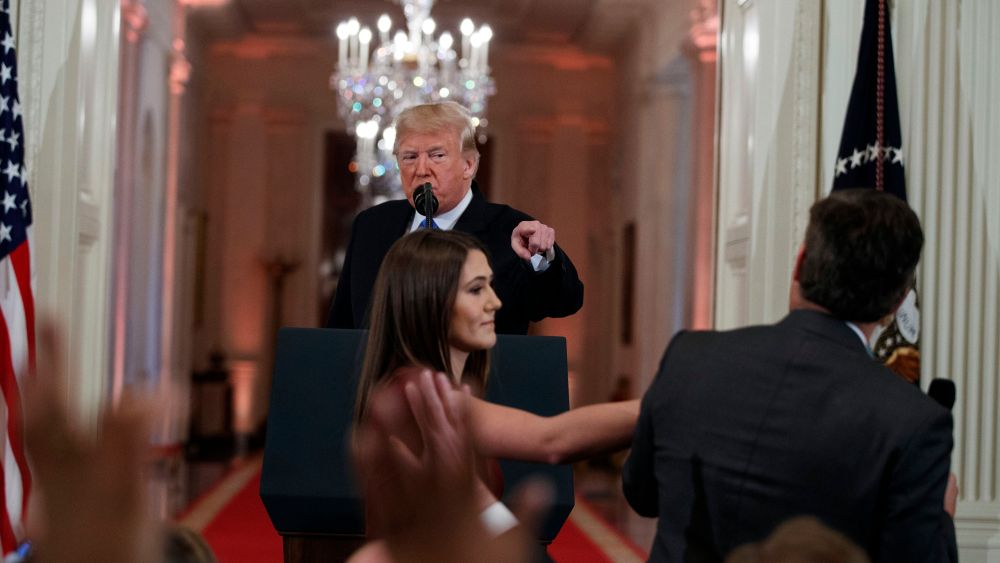 Donald Trump, Jim Acosta. President Donald Trump watches as a White House aide reaches to take away a microphone from CNN journalist Jim Acosta during a news conference in the East Room of the White House in Washington. CNN is suing the Trump administration, demanding that Acosta's press credentials to cover the White House be returned. The administration revoked them last week following President Trump's contentious news conference, where Acosta refused to give up a microphone when the president said he didn't want to hear anything more from himMedia CNN vs Trump, Washington, USA - 07 Nov 2018
