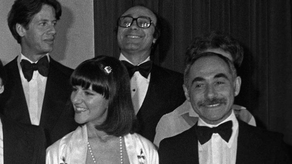 Betty Ford and the critics: (back row: Liz Claiborne, Shannon Rodgers, Leo Narducci (hidden), Anthony Muto, Calvin Klein, Piero Dimitri, Ann Keagy of Parsons (hidden). Front row: Donna Karan, Donald Brooks, Albert Capraro, Betty Ford, Kasper, Kay Unger, Chester Weinberg.Calvin Klein, Piero Dimitri,
