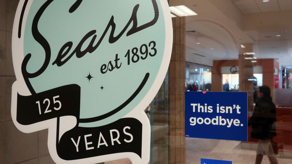 In this Nov. 2, 2018 photo, a sign in the window at Sears promises that "This isn't goodbye," at the Livingston Mall in Livingston, N.J. Sears is closing 80 more stores as it teeters on the brink of liquidation. The 130-year old retailer set a deadline of for bids for its remaining stores to avert closing down completelySears, Livingston, USA - 02 Nov 2018