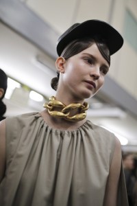 Jonathan Anderson delivered a colorful collection filled with soft silhouettes and long drapes. The fluidity of the clothes was juxtaposed with tougher-looking accessories including these structured leather caps and large chokers done in a rusty, vintage-inspired gold. — N.T.