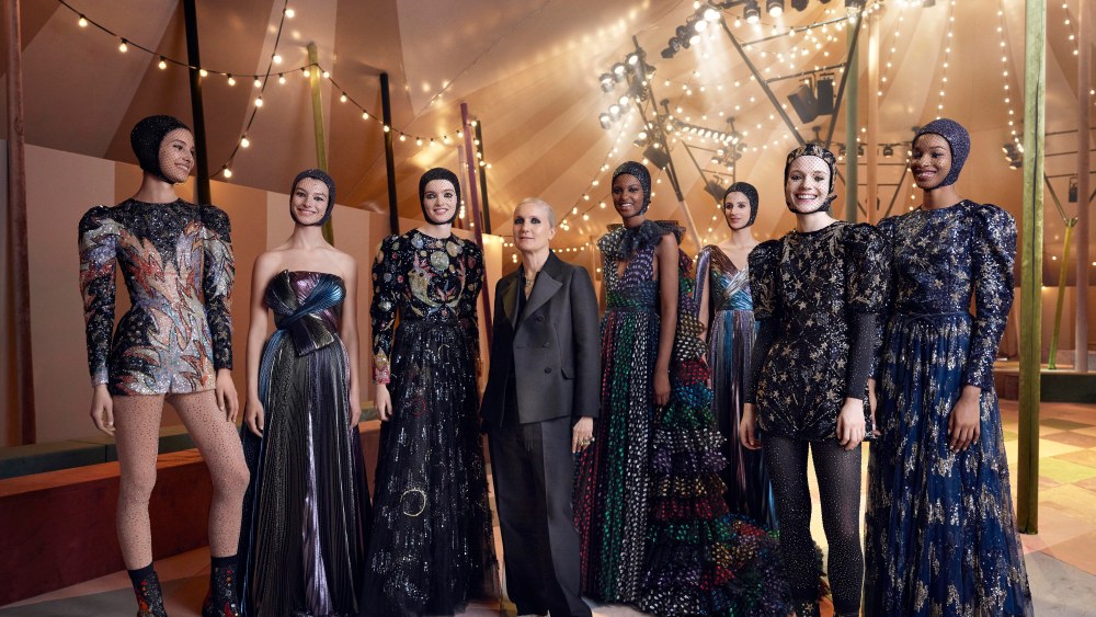Maria Grazia Chiuri poses with models in Dubai.