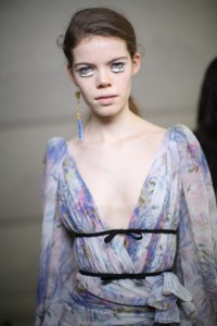 ÒOur girl is in the Eighties, sheÕs very Parisian,Ó said makeup artist Val Garland before the Giambattista Valli show, adding the influence for the look was a cross between Guy Bourdin and the movie ÒFame.Ó ÒMakeup is very considered, done in its simplicity. ItÕs a bit of a nod toward a Brooke Shields brow Ñ itÕs a nice, filled-in brow, quite bushy. Then itÕs beautiful, polished, finished, peachy skin. Not a highlight in sight.Ó ModelsÕ skin was given a matte finish and their lips a beige-like hue. Eleven models got a chromatic eye (Òmy nod to ÔFame,ÕÓ said Garland). ÒWeÕre using black, white, silver and a little bit of glitter,Ó she explained, referring to the look involving a curvy white line drawn over modelsÕ lids and a black liner used under their lower lids. Blow that was placed a black, white and gray strip with a sparkly fringe Òlike a visor,Ó Garland said. ÒIt made [the look] more futuristic and less delicately eyelash-y.Ó MAC Cosmetics were used backstage. Ñ Jennifer Weil