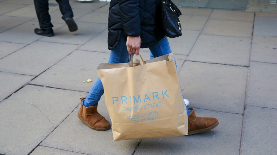 Person carrying Primark bag