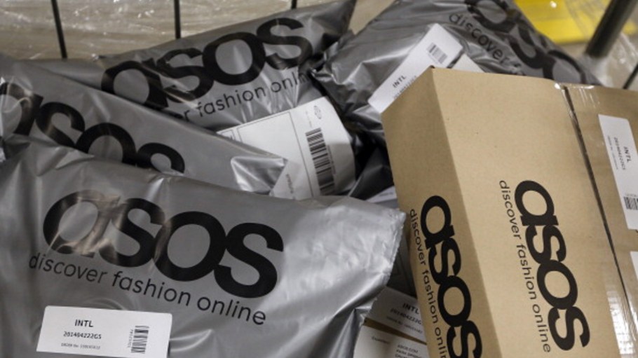 Completed customer orders sit in a trolley ahead of shipping at Asos Plc's distribution warehouse in Barnsley, U.K.