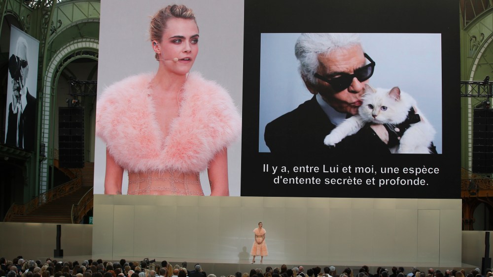 Model Cara Delevingne is seen on a giant screen as she speaks to the invited guests during the event named "Karl for Ever" at the Grand Palais in Paris, France, . The event pays tribute to late German fashion designer Karl Lagerfeld who died Feb. 19, 2019Lagerfeld Tribute, Paris, France - 20 Jun 2019