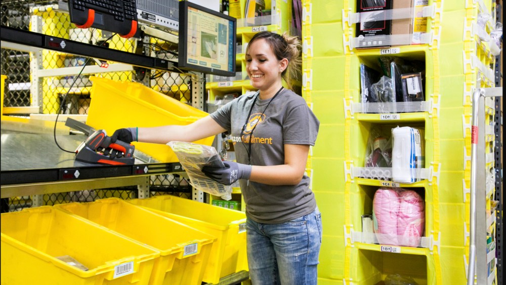 An employee picking at an Amazon fulfillment center.