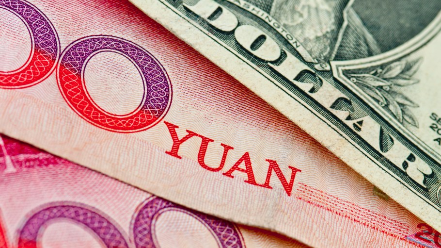 close up of yuan currency and us dollar