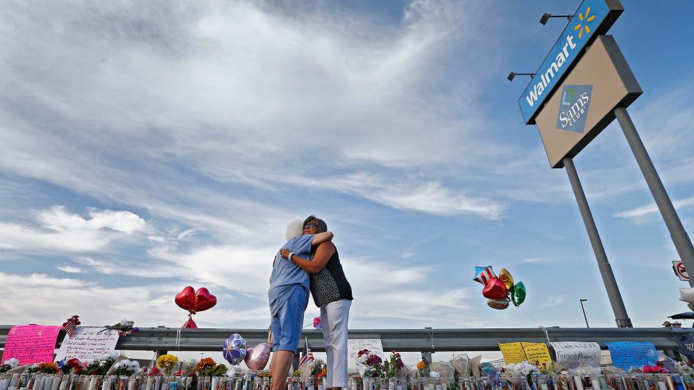 Emma Del Valle (L) hugs Brenda Castaneda (R) while attending the make shift memorial along the street after the mass shooting that happened at a Walmart in El Paso, Texas, USA, 05 August 2019. Twenty people killed and forty injured from the mass shooting at the Walmart in El Paso, Texas, on 03 August 2019.Mass shooting at Wal-Mart in El Paso, Texas, USA - 05 Aug 2019