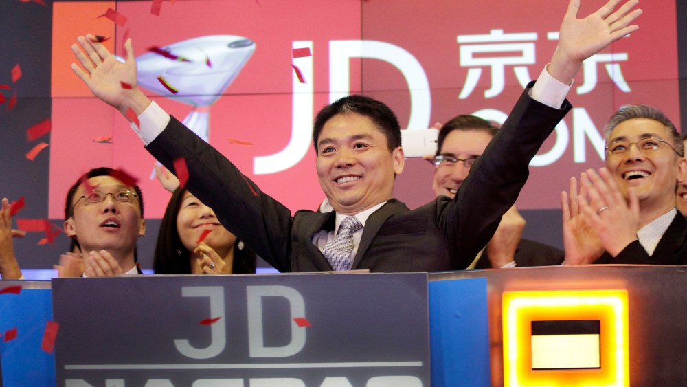 Richard Liu, CEO of JD.com, raises his arms to celebrate the IPO of his company in New York.