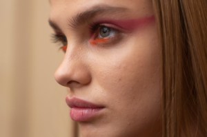 The beauty look at Oscar de la Renta for spring 2020 was individualistic all around, but not strictly in a no-makeup makeup way. Makeup artist Tom Pecheux, who keyed the show for MAC, either left models nearly bare in terms of makeup, or went wild with bold dashes of bright yellows, pinks, blues and oranges around the eye. Color is making a comeback this season, he said, because of the need for something bright and happy. "When you go to see a piece of art with or without explanation, sometimes itÕs a completely different thing...when somebody explains to you why the artist did it and the meaning of the work, itÕs very impressive," Pecheux said. Ñ Allison Collins