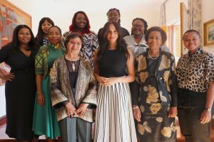 Meghan Duchess of Sussex (Centre) invited a group of South African women leaders including Sophia Williams-De Bruyn, Dr. Mamphela Ramphele, Professor Mamokgethi Phakeng, Lindiwe Mazibuko, Judy Sikuza, Mbali Ntuli, Siviwe Gwarube, Nompendulo Mkatshwa and Sonja De Bruyn Sebotsa, to join her in Cape Town, to better understand the roles they play - and have played - for their country and their communities.Prince Harry and Meghan Duchess of Sussex visit to Africa - 28 Sep 2019Each of the women were from different generations, different political parties, different backgrounds, and different regions, yet each had a common purpose and drive for gender equality and womens empowerment. During their time together, the women were able to share the struggles they have faced, their action plan for the future, and the root cause and accompanying feeling of the issue at hand. Wearing Misha Nonoo, Top, Wearing J Crew, Skirt