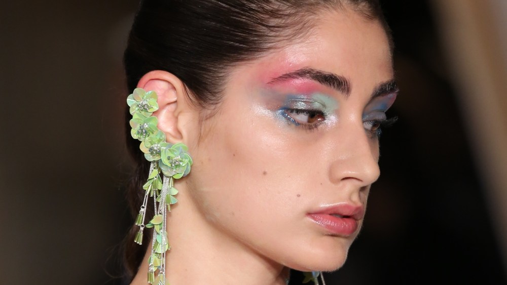The vibe was "painterly," said Erin Parsons, who led makeup for Maybelline. To get the look, Parsons mixed custom shades of pink, blue and sea foam green and used her fingers to smear the shadow across models' lids, and the heel of her palm to push splashes of color up through the eyebrow. The makeup was similar for girls and boys. "We're doing sort of smaller versions on the boys, which kind of feels David Bowie-esque, which I really love. It's really working well on themÉthere are certain ones that look hot," Parsons said. Ñ Allison Collins