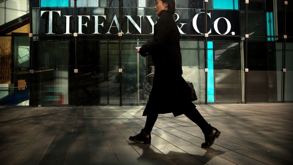 A woman walks past a Tiffany & Co. store at a shopping mall in Beijing. The designer boutiques of Manhattan and Paris are feeling the chill of a Chinese economic slowdown that has hammered automakers and other industries. That is jolting brands such as Louis Vuitton and Burberry that increasingly rely on Chinese customers who spend $90 billion a year on jewelry, clothes and other high-end goods. The industry already is facing pressure to keep up as China's big spenders shift to buying more at the spreading networks of luxury outlets in their own countryLuxury Shopping Chill, Beijing, China - 29 Nov 2018