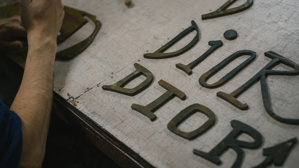 A Japanese craftsman works on a Dior print designed in collaboration with Shawn Stussy.