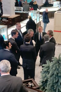 Bernard Arnault flanked by LVMH and Tiffany executives.