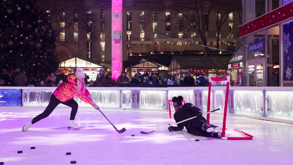 Lindsey Vonn working on her slapshot against fiance P.K. Subban at Bryant Park.