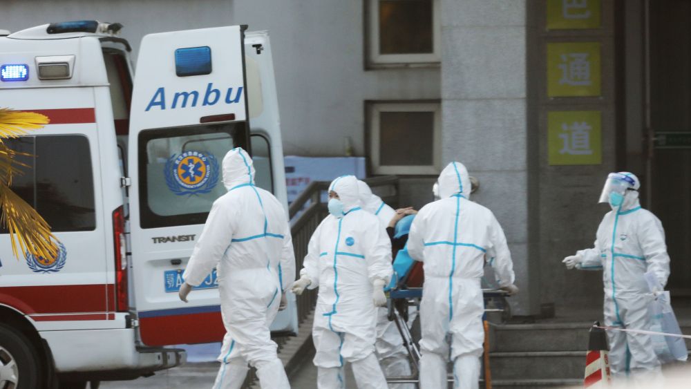 Medical staff transfer coronavirus patients in Wuhan, China.