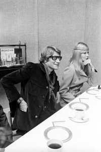 Yves Saint Laurent and Betty Catroux at  Yves Saint Laurent's Rive Gauche collection, modeled around the big conference table at the Lanvin-Charles of the Ritz offices, 1968