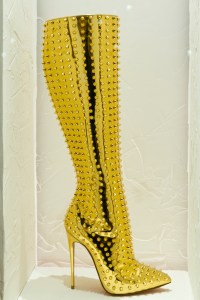 A golden boot riddled with studs.