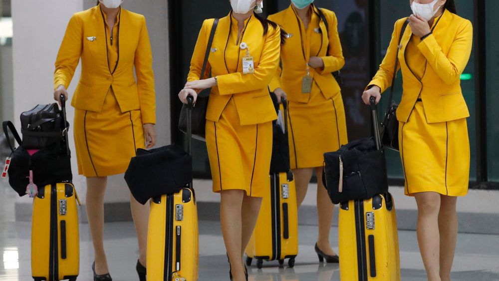 Flight attendees wearing surgical masks arrive at Don Mueang Airport in Bangkok, Thailand, 07 February 2020. Thai Public Health officials said that the number of people infected with the novel coronavirus in Thailand remained at 25. Nine had been discharged from hospitals. The virus has killed so far at least 638 people and over 31,000 others were confirmed infected, mostly in China.Thailand's surveillance measures against coronavirus outbreak, Bangkok - 07 Feb 2020