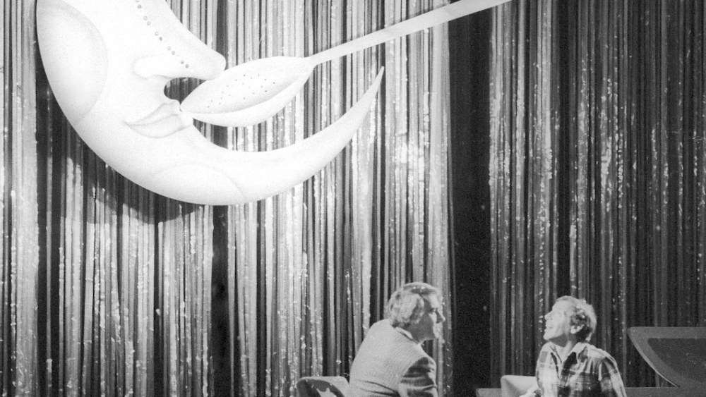 Ian Schrager and Steve Rubell at Studio 54 beneath the “Moon and the Spoon” prop.