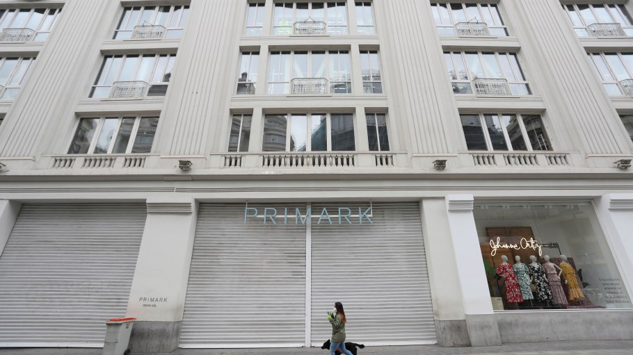 A woman walks her dog past a closed Primark store in downtown Madrid, Spain, 20 March 2020. The pandemic caused an unexpected economic crisis. Spain faces the sixth day of national lockdown on 20 March in an effort to slow down the spread of the pandemic COVID-19 disease. According to the latest figures provided by the health ministry, there are at least 18,074 confirmed coronavirus infections throughout Spain, while 832 people have died so far in the Mediterranean country. Coronavirus crisis, Madrid, Spain - 20 Mar 2020