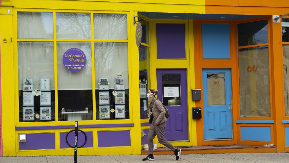 A pedestrian wearing a mask walks past a closed business in Boston, Massachusetts, USA, 14 April 2020. Massachusetts Governor has asked residents to conform to social distancing, work from home and remain home when ever possible to control the spread of the disease and issued an emergency order requiring all businesses and organizations that do not provide 'COVID-19 Essential Services' to close their physical workplaces and facilities to workers, customers and the public and many small businesses are in danger of not recovering when the economy re-opens. Countries around the world have closed borders, schools as well as public facilities, and have cancelled most major sports and entertainment events in order to prevent the spread of the SARS-CoV-2 coronavirus causing the Covid-19 disease.Coronavirus Covid-19 Boston closed businesses, USA - 14 Apr 2020