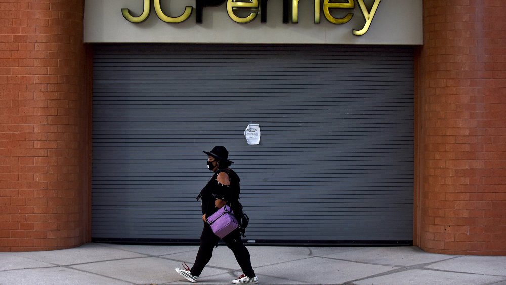 woman walks closed JC Penney mask coronavirusl