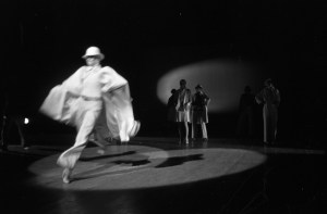 A model dressed in all white and a bowler hat runs across the stage during the fashion show to benefit the restoration of the Chateau of Versailles, five American designers matching talents with five French couturiers at the Versailles Palace on November 28, 1973 in Versailles, France...Article title: 'One night and pouf! It's gone!
Battle of Versailles, Versailles