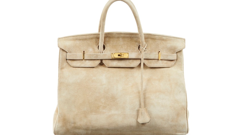 A 1986 Birkin bag in beige Veau Doblis suede with gold-plated hardware.