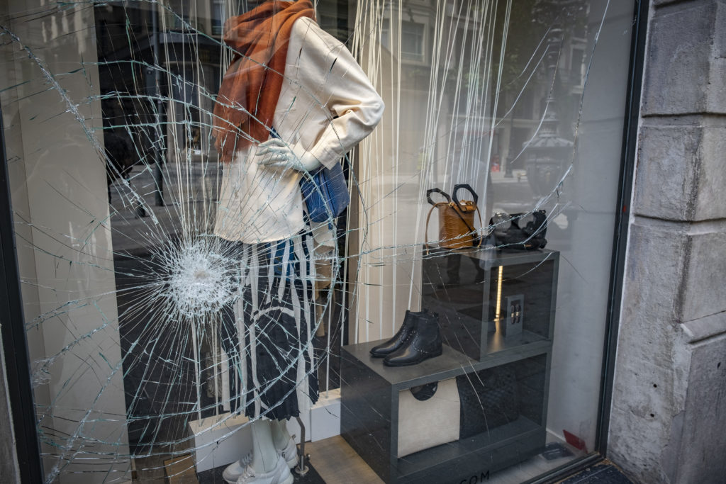 The glass window of a central store in the commercial area is seen damaged during Phase zero of Covid-19. Since May 04th, local commerce has been reopened, but due to the Covid-19 precaution and hygienic measures, social distancing and other security measure will be applied which might result to a slow turnover for many shopkeeper.