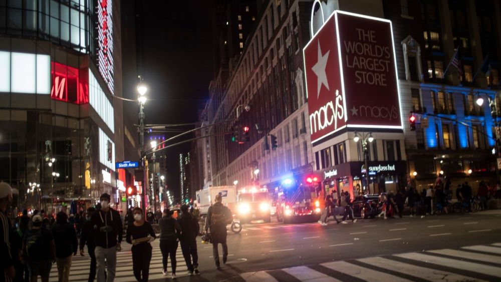 Police vehicles park outside Macy's store after it was broken into hours after a solidarity rally calling for justice over the death of George Floyd at the hands of Minneapolis police.