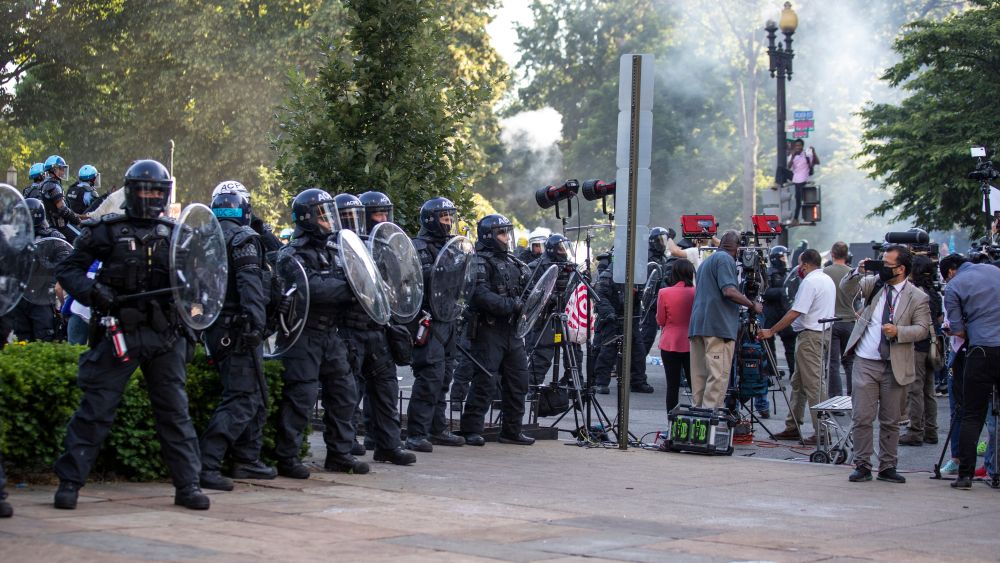 Arlington County Police officers attempt to move a news crew from in front of St. John's Church as demonstrators are moved back after gathering to protest the death of George Floyd, near the White House in Washington. Floyd died after being restrained by Minneapolis police officersAmerica Protests , Washington, United States - 01 Jun 2020