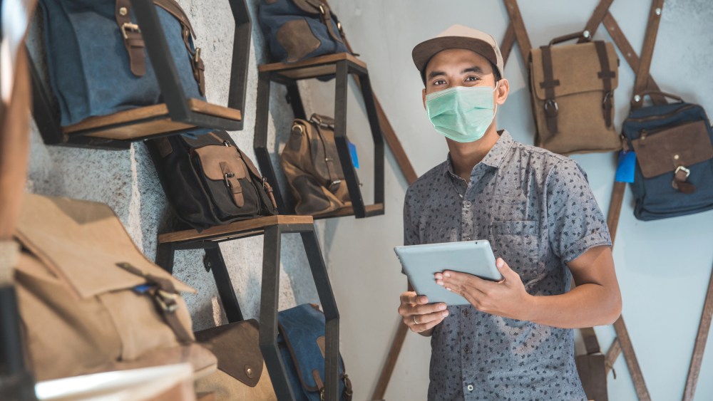 sick male business owner keep working and wear face masks