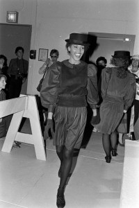 Model and singer Whitney Houston appears in Willi Smith’s Fall 1982 fashion show.