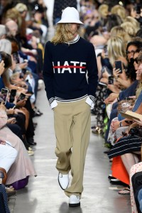 "We need love, and we need to cancel out the hate," Kors told clients at his company trunk show in May. He noted that this sweater has "a wonderful message." And in lightweight cashmere, "it's a perfect year-round piece."